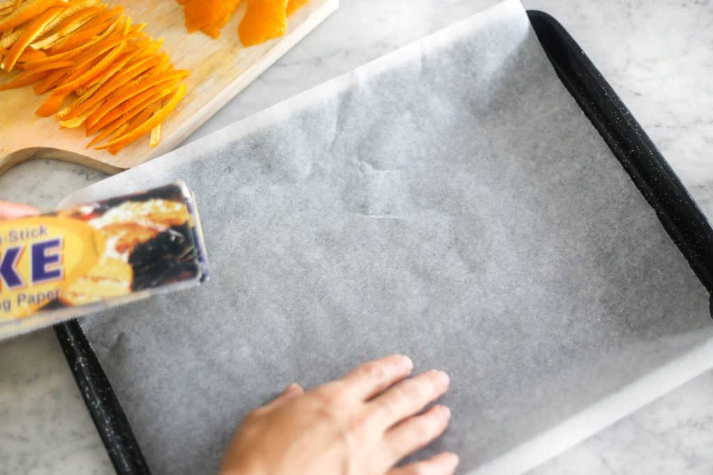 Lay your orange peel on baking paper