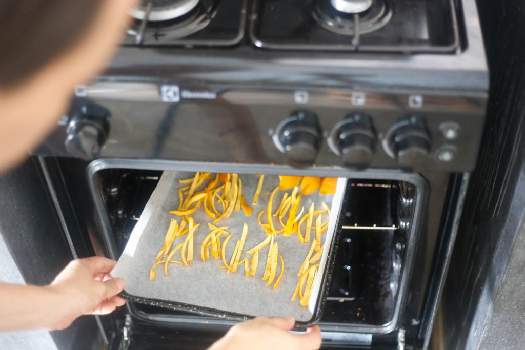 To dry orange peel, place in a warm oven