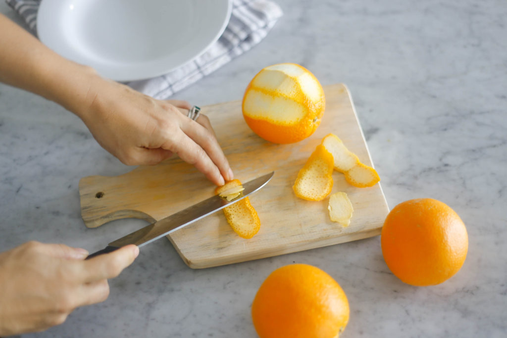 Removing pith from oranges