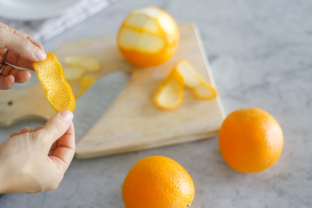 Removing the pith from oranges